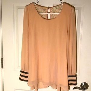 Peach colored blouse